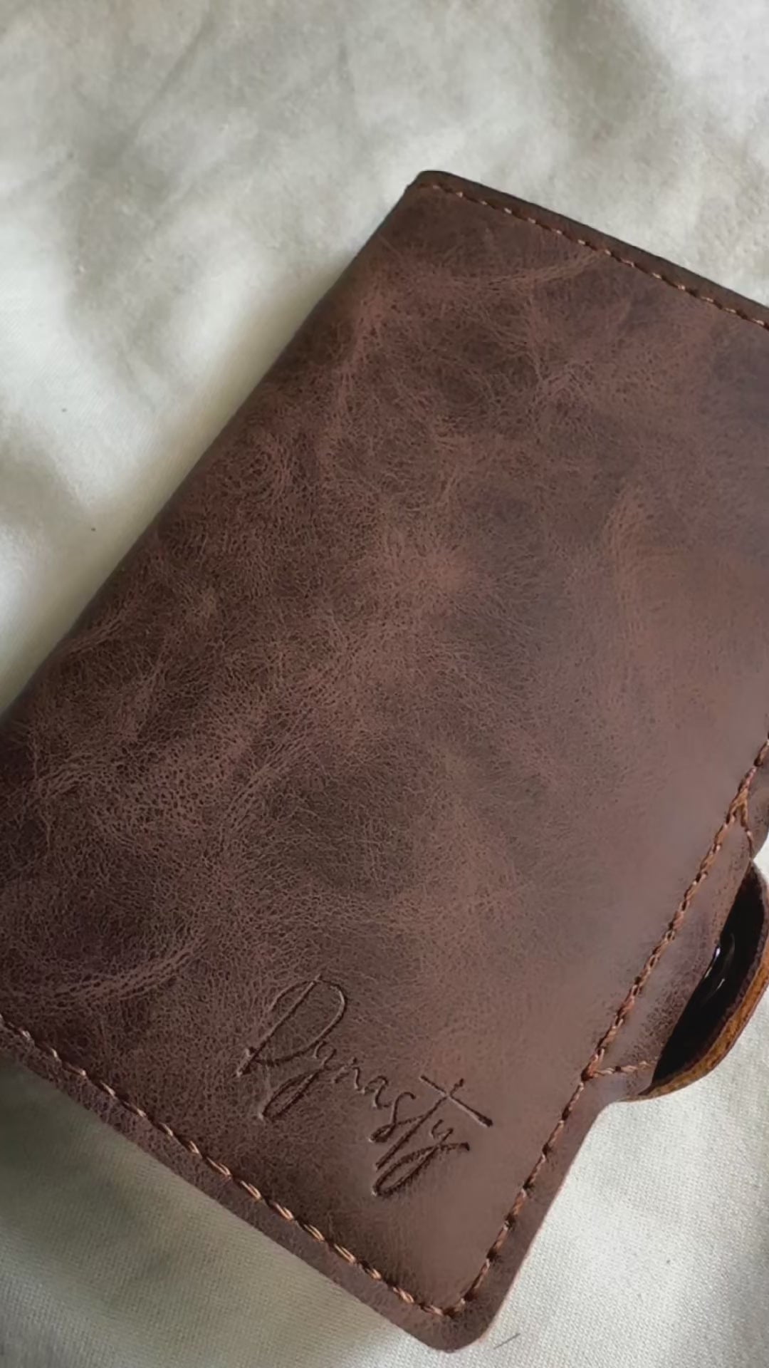 Load video: Dynasty Wallet compared to standard bifold, noting the size difference and rfid protection making it the superior ED Carry.